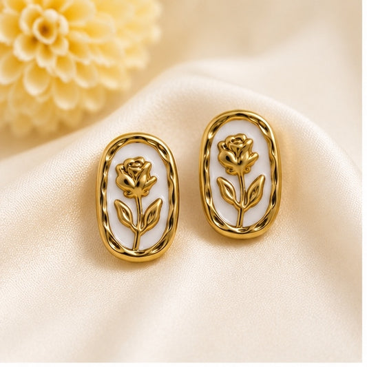 Vintage gold-tone oval stud earrings with embossed rose floral design and white enamel for women by Glanz Jewels.