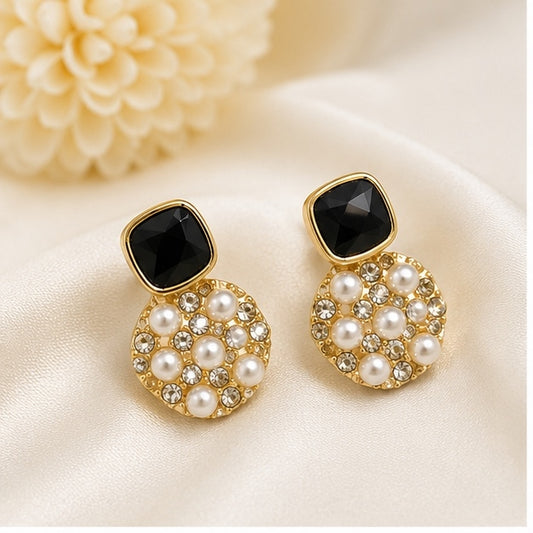 Luxury gold-plated black stone pearl drop earrings with crystal embellishments for women by Glanz Jewels.