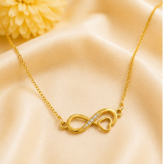 Gold infinity heart necklace for women with crystal accents in anti tarnish stainless steel.