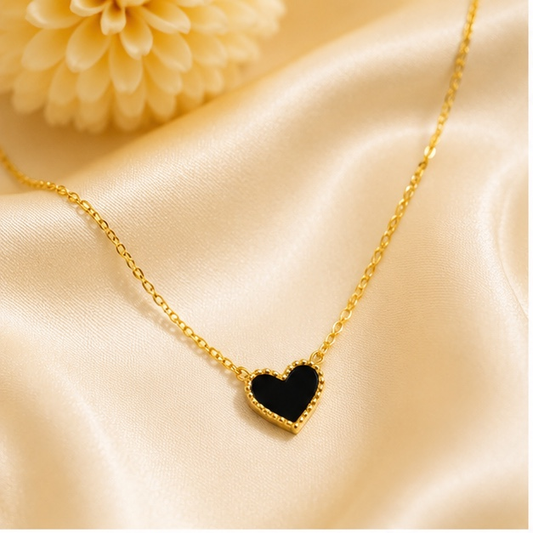 Black heart pendant necklace for women in anti tarnish stainless steel with gold finish.